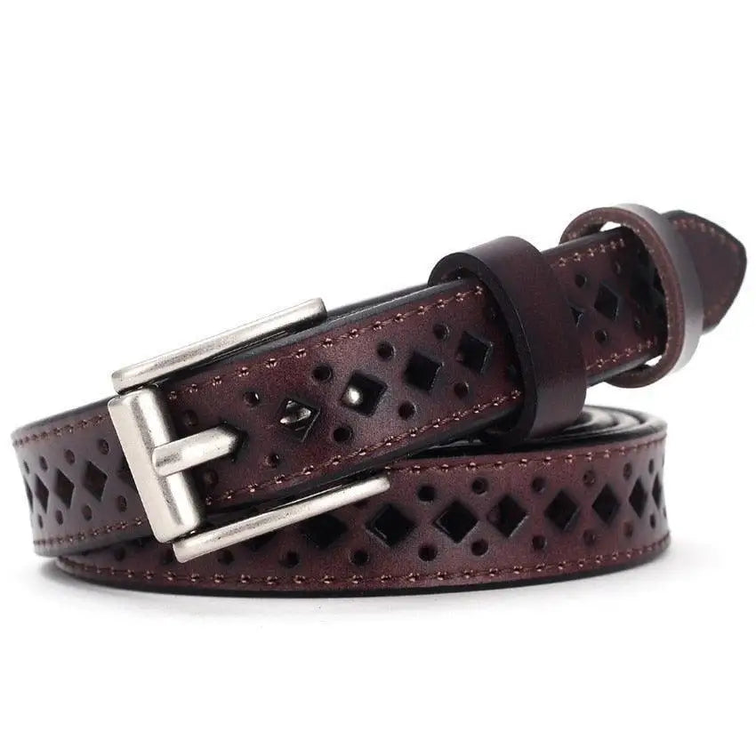 Burgundy leather belt with diamond cutouts displayed with distressed denim shorts