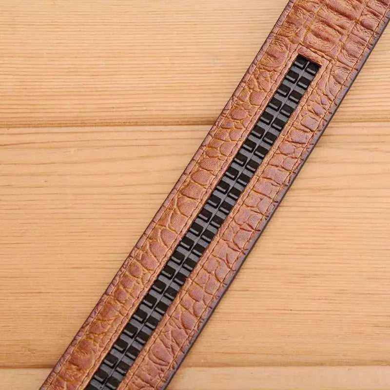 Brown crocodile leather belt with textured pattern and dragon buckle for sophisticated style