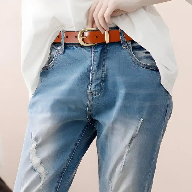Distressed Blue Jeans with Golden Buckle Leather Belt displayed in stylish apparel collection