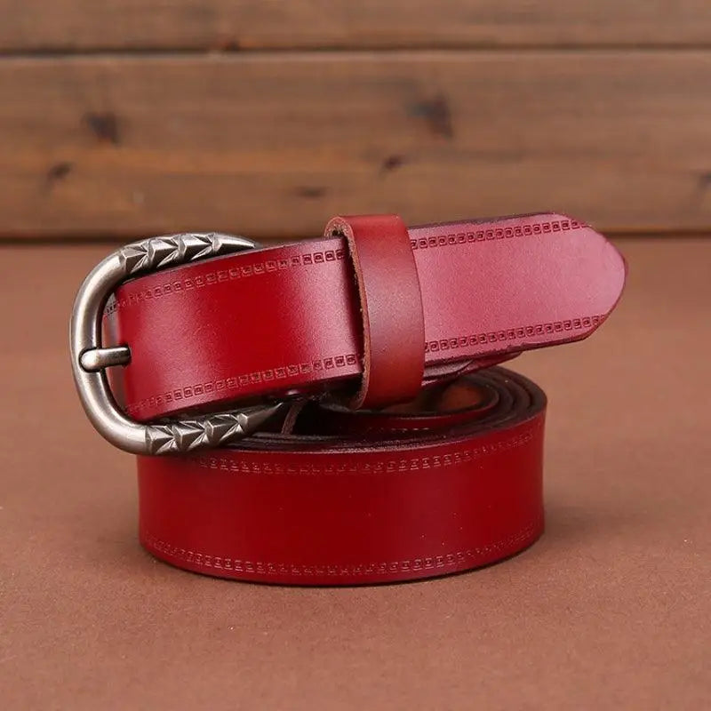 Red leather belt with ornate buckle from the Gaby Belt in Brown Leather collection