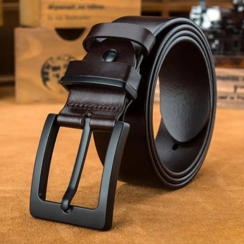 Brown leather belt with matte black buckle, ideal for elegant style and formal wear