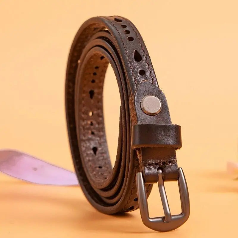 Anei Leather Belt with metal buckle and decorative perforations, showcasing leather belt style