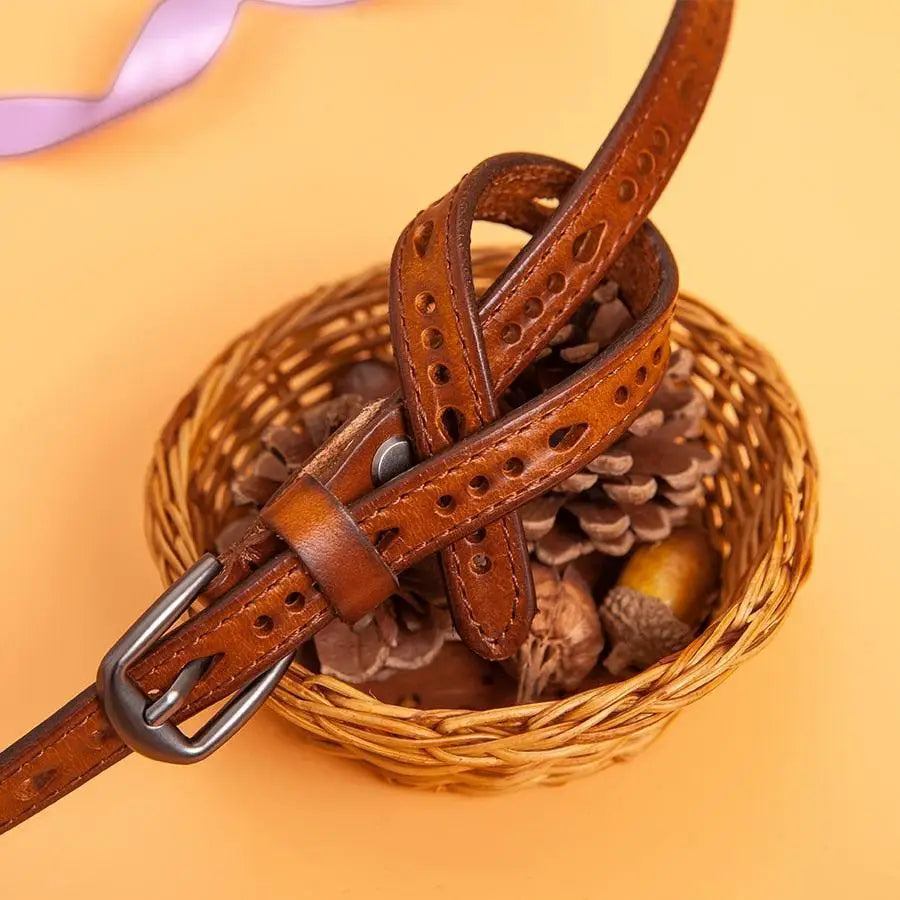 Anei Leather Belt with Metal Buckle and Knot Design showcasing decorative perforations