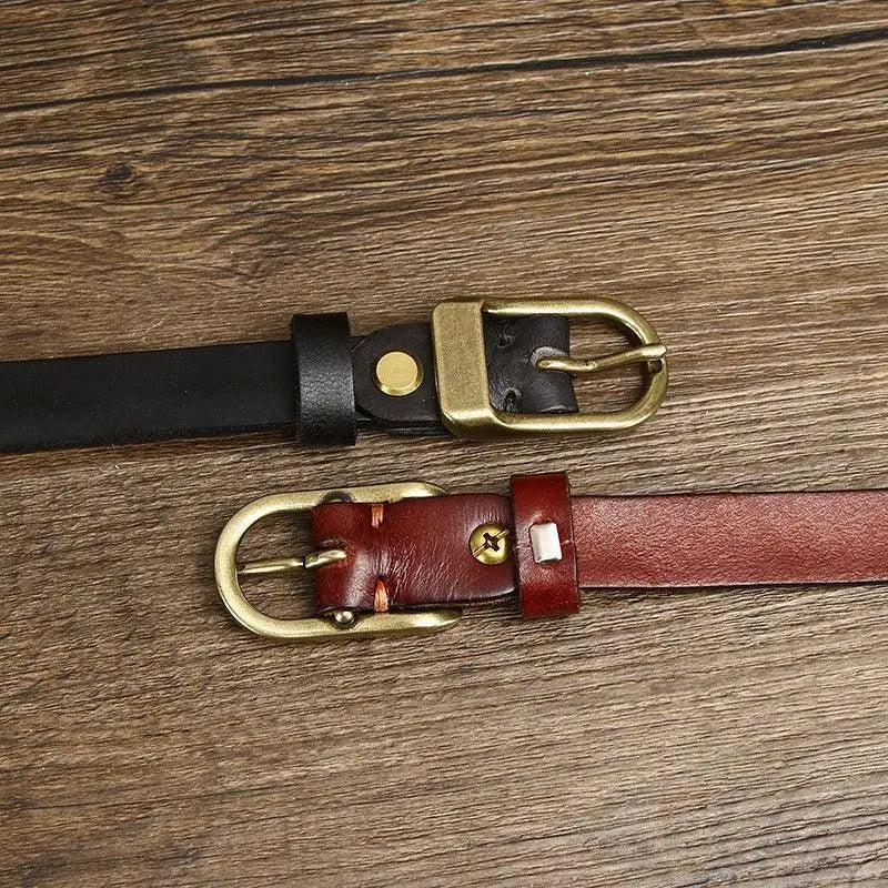 Two full-grain leather belts with brass and gold buckles for versatile style