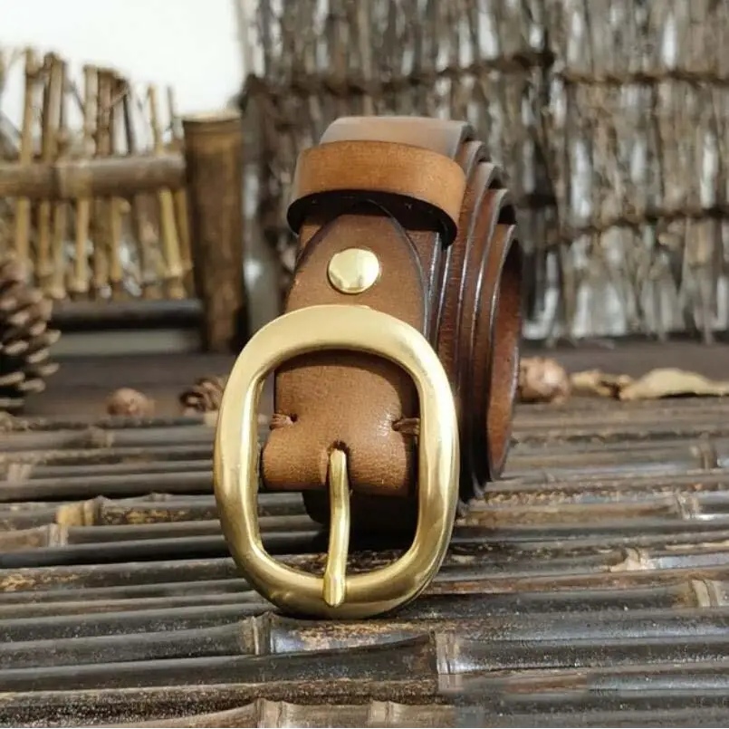 Leather belt with brass buckle for a classic style in brown leather product display