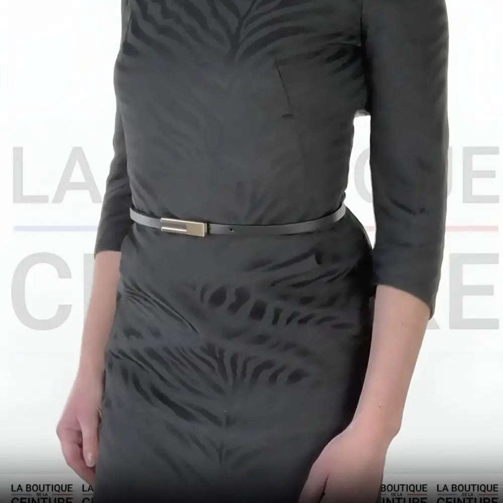 Black women’s leather belt with thin design and gold buckle for stylish outfits