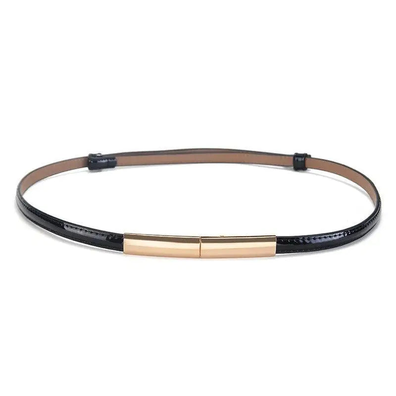 Black patent leather belt with a gold buckle from the Stacked Patent Leather Belts collection