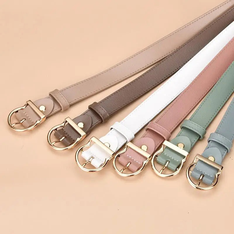 Assorted colorful leather belts with gold buckles displayed in a product image