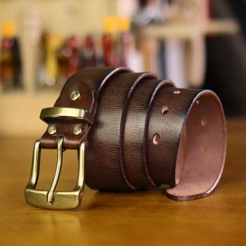 Rolled brown Leather Belt with Gold Metal Buckle featuring Paki Belt branding