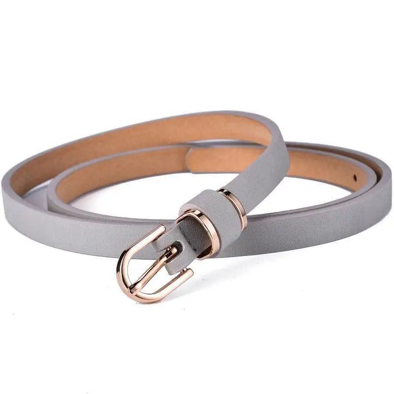 Roxane leather belt with gold buckle paired with beige choker-neck sweater