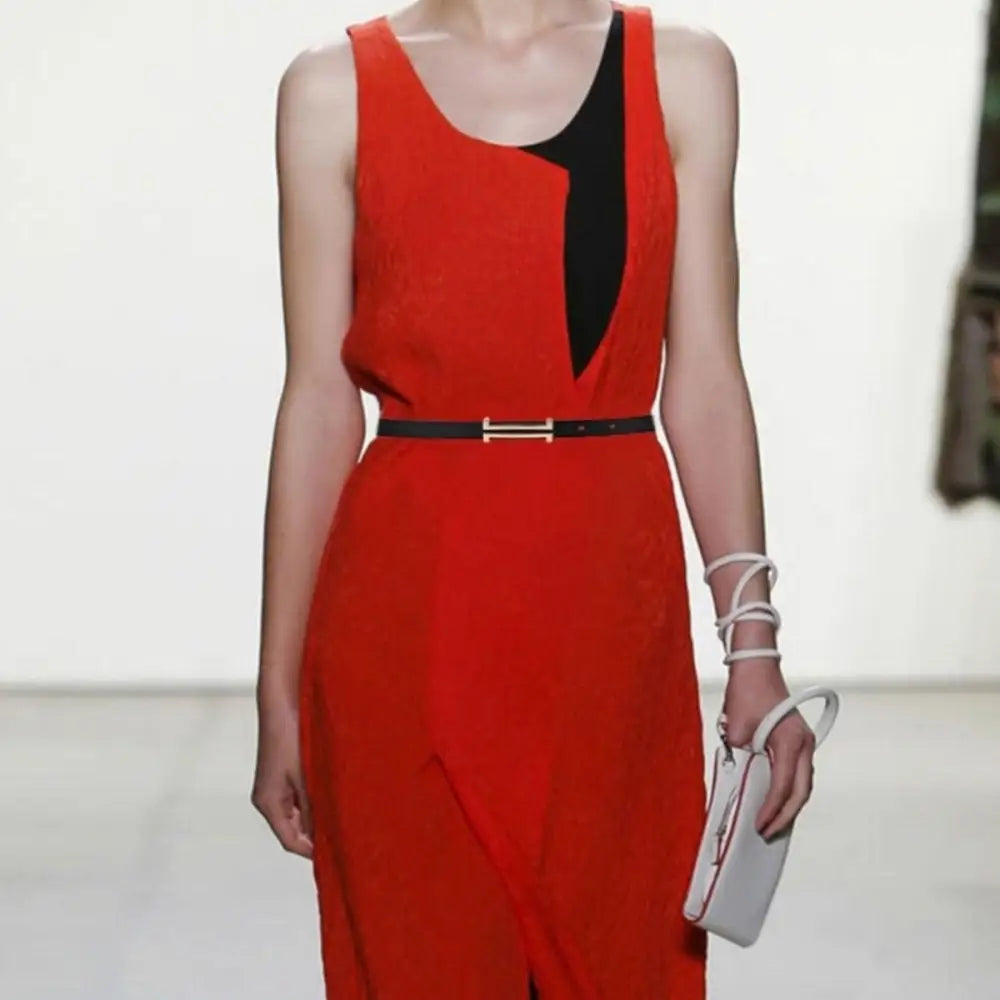 Red sleeveless dress with black accents paired with Zaka Women’s Belt for elegant style