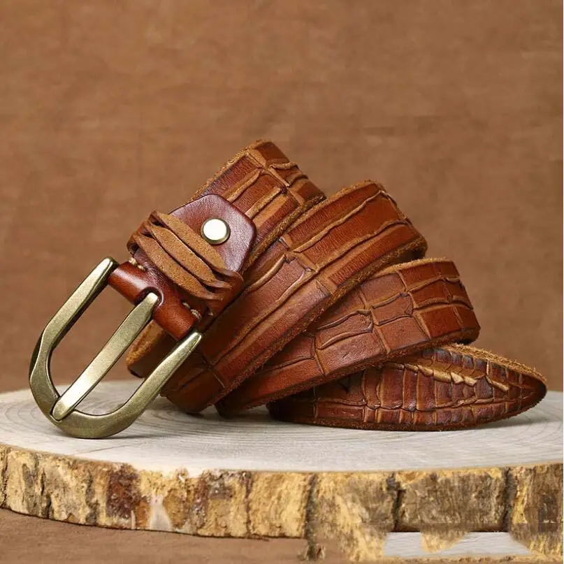 Leather belt with crocodile pattern and brass buckle showcasing quality craftsmanship