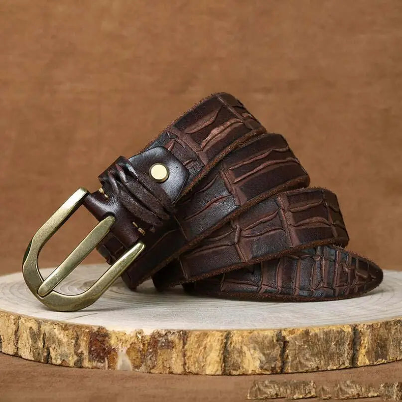 Brown leather belt with crocodile pattern and brass buckle showcasing quality craftsmanship