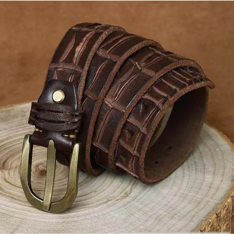 Brown leather belt with crocodile pattern and brass buckle showcasing quality craftsmanship