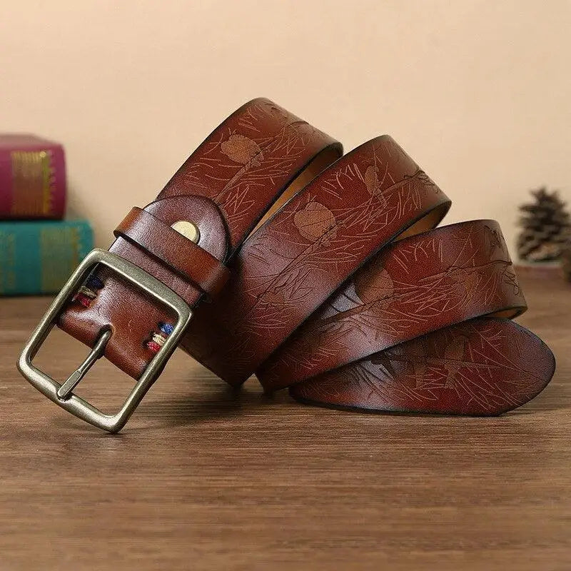 Brown leather belt featuring a floral pattern from the Set of Four Leather Belts with Brass Buckles