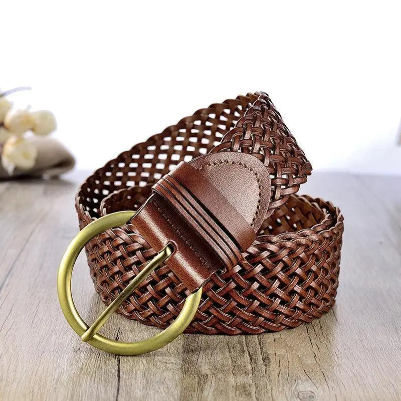 Woven leather belt with a circular gold buckle for elegant style and craftsmanship