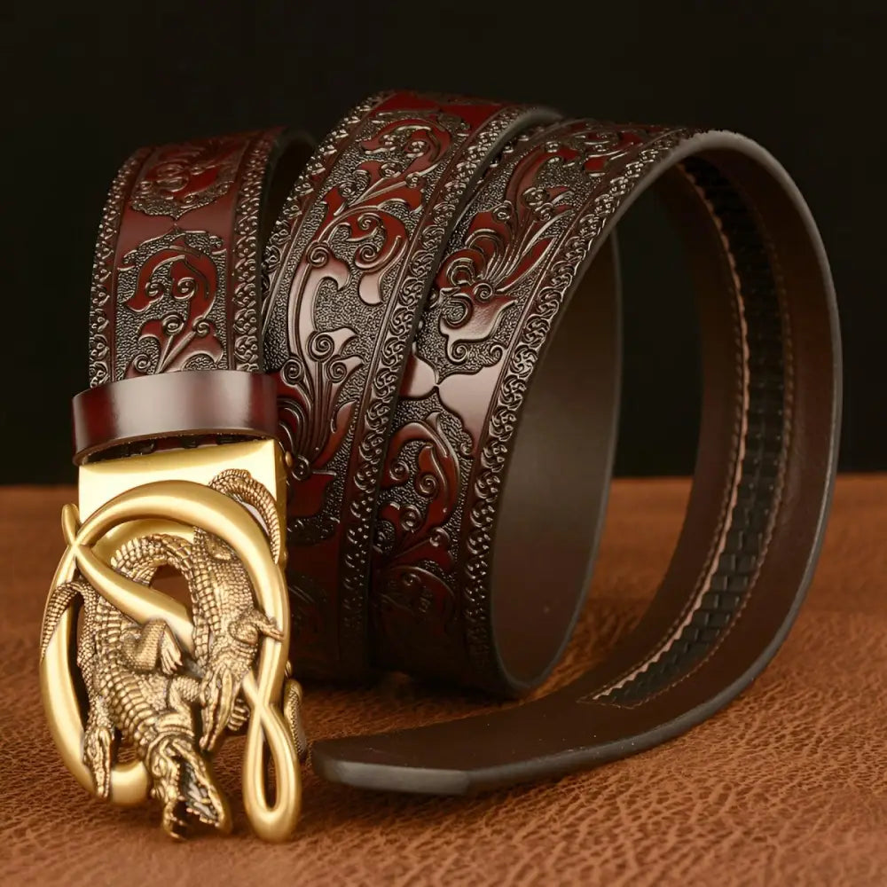 Embossed leather belt featuring a crocodile buckle and intricate dragon design