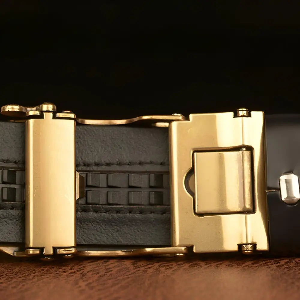 Gold-buckled black leather belt featured in Embossed Leather Belt with Dragon Buckle in Brown product image