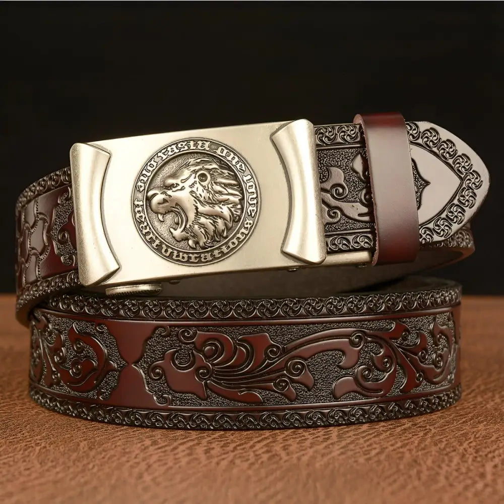 Embossed leather belt with lion’s head motif and detailed lion’s head buckle design