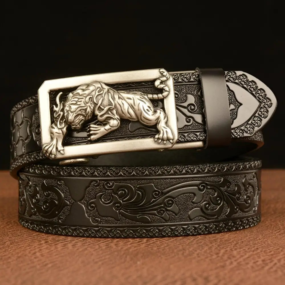 Embossed leather belt featuring a striking tiger buckle enhancing style and sophistication