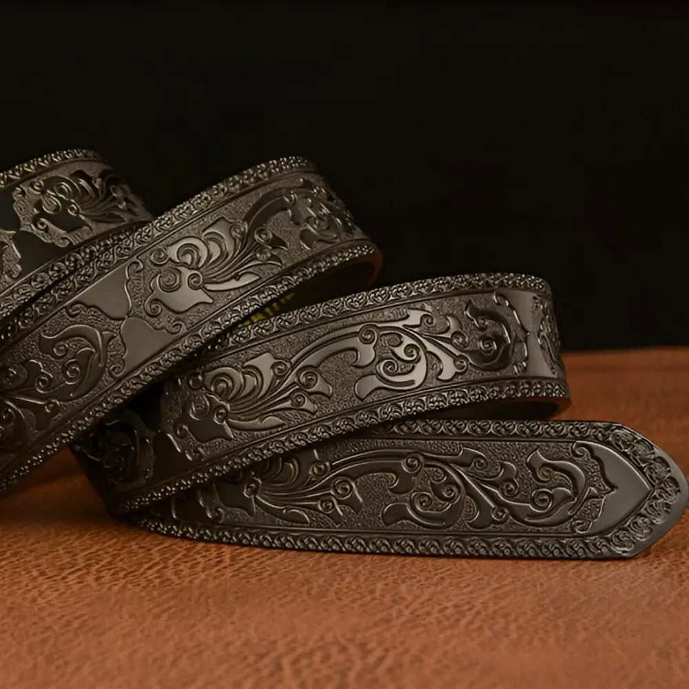 Elegant embossed leather belt featuring a striking Tiger Buckle for stylish accessories