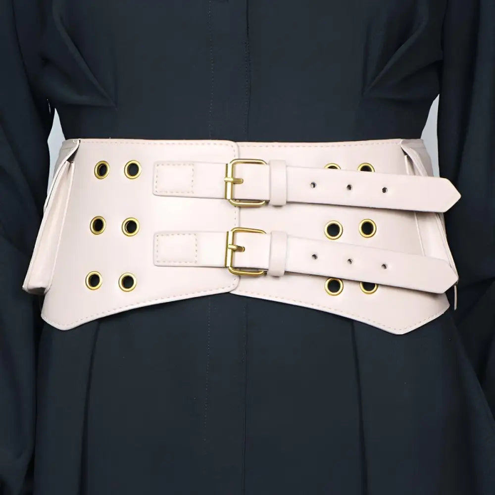 Pale pink faux leather corset belt with gold buckles and eyelets from Collection