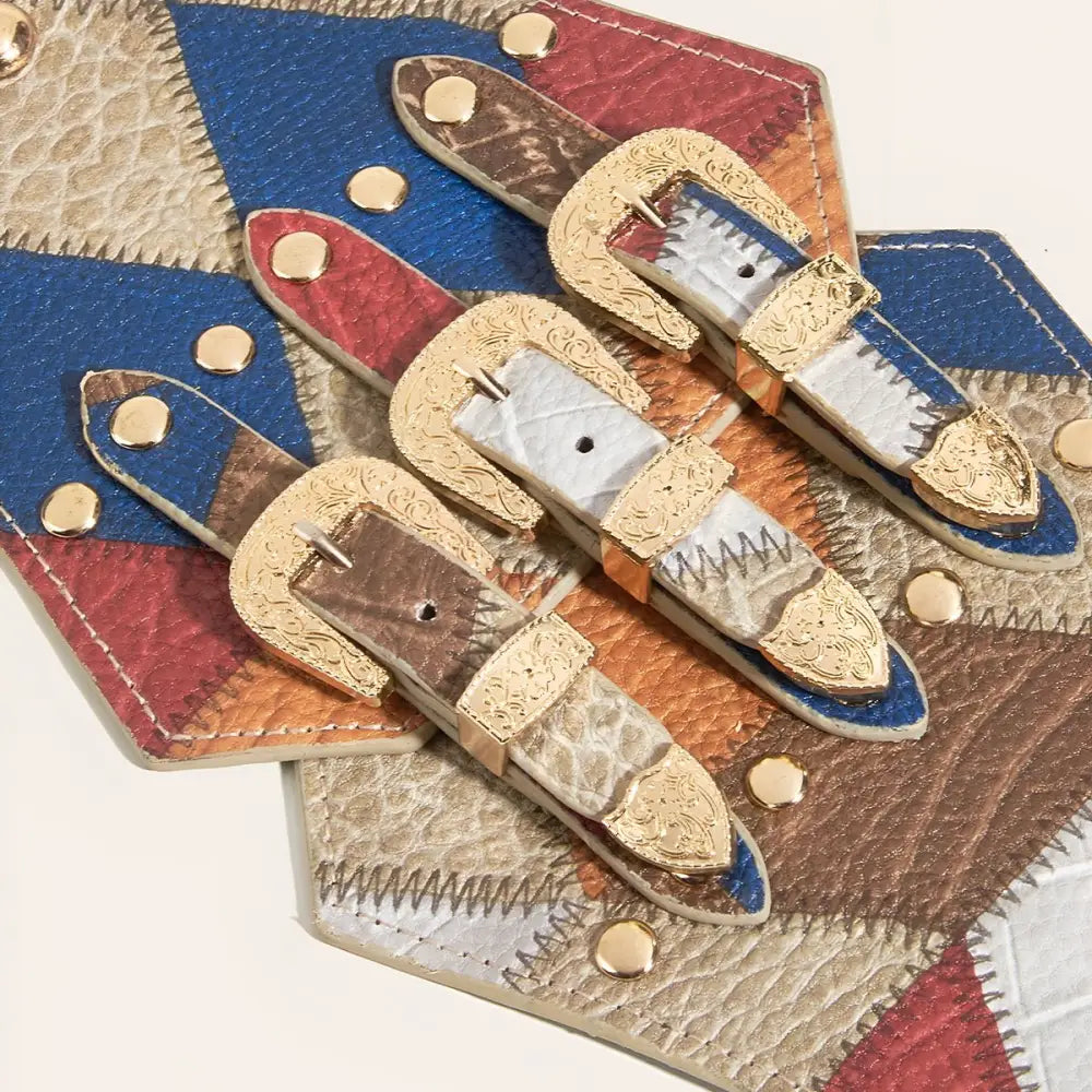 Colorful patchwork belt with gold buckles showcasing vibrant fabric and metallic accents