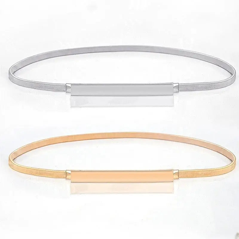 Silver and gold metal belts from Dhoxia Slim Belt with gold-toned buckle for elegant fit