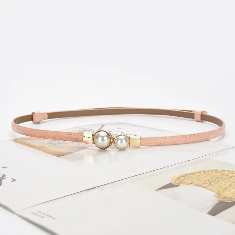 Pink faux leather women’s slim belt with pearl accents for stylish women’s slim accessories