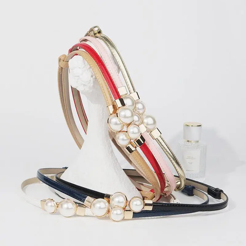 Colorful pearl-accented women’s slim leather belt in mint and vibrant styles