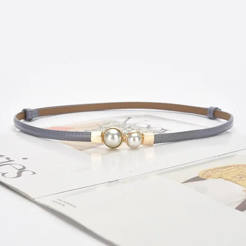 Gray women’s slim leather belt with pearl buckle and colorful accents for stylish outfits