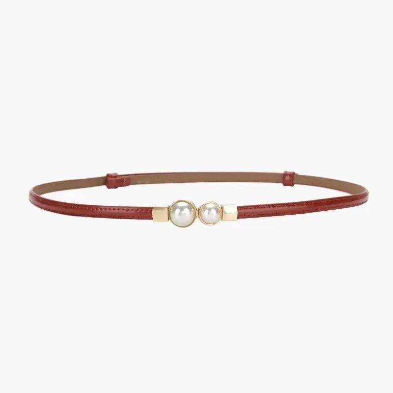 Red women’s slim leather belt with pearl embellishments for stylish attire
