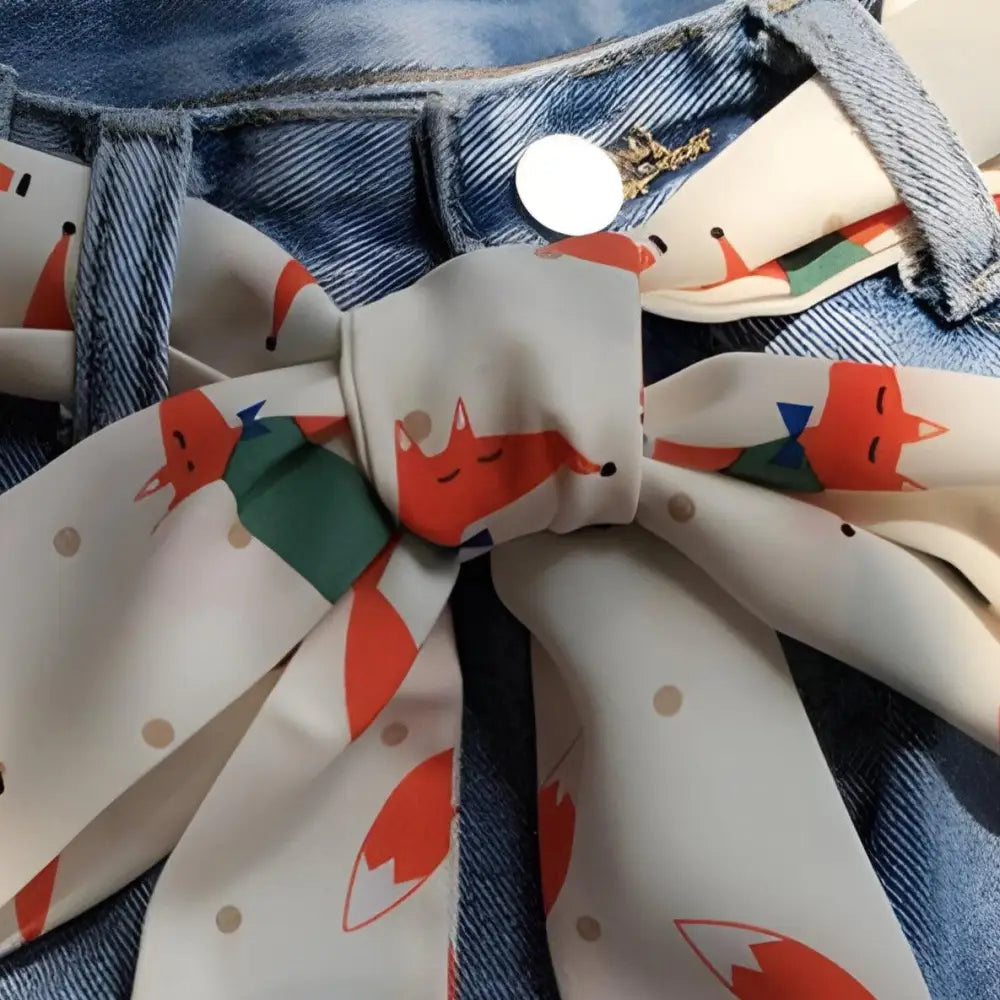 Denim jeans paired with a fox-patterned scarf from Fashionable Denim Outfits collection