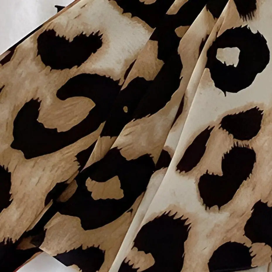 Leopard print fabric showcasing the Fosca Scarf Belt for stylish home and fashion accessories
