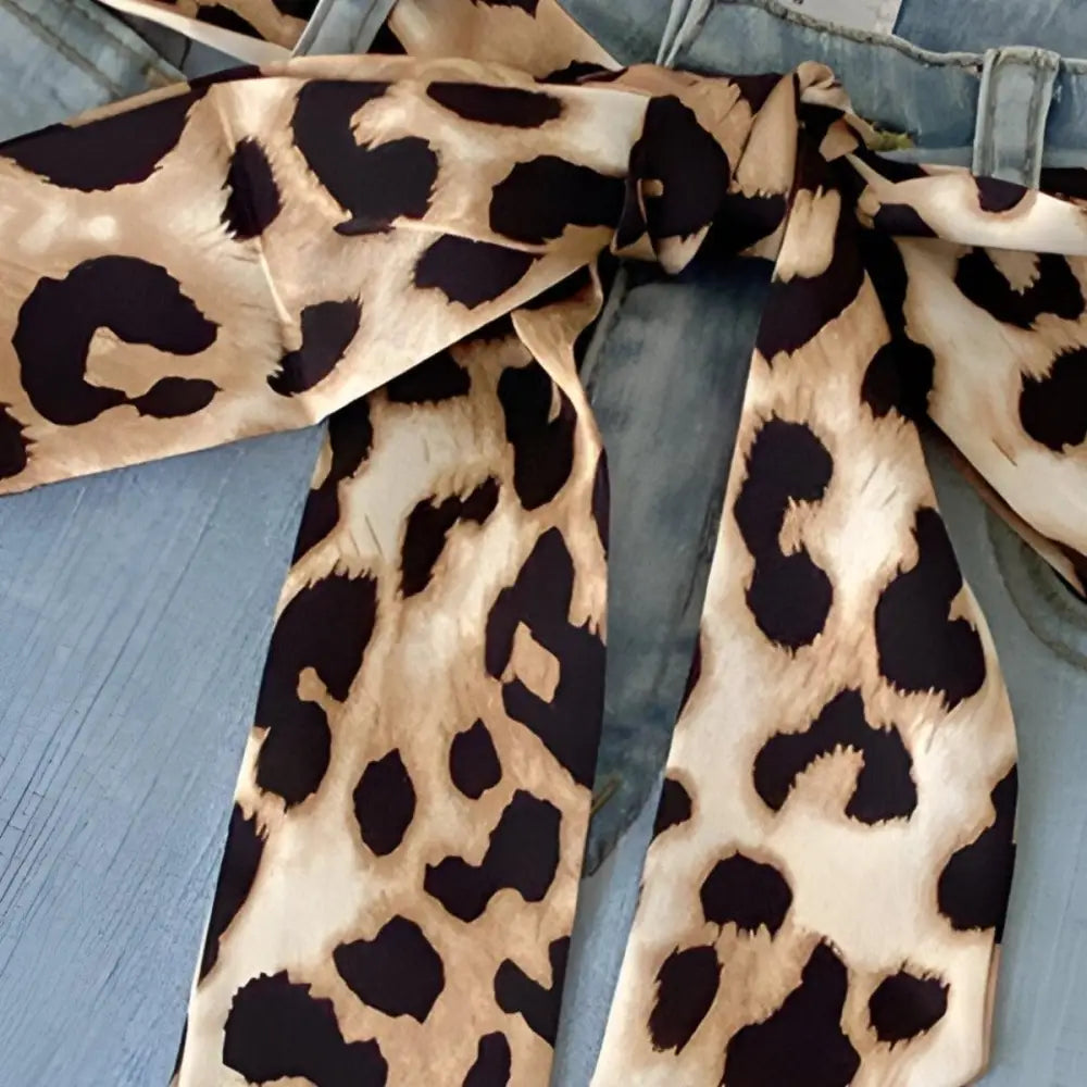 Leopard print Fosca scarf belt tied around jeans, stylish home and fashion accessory