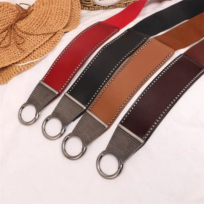 Colorful studded elastic belts featuring the Christina Belt with leather design and metal buckle