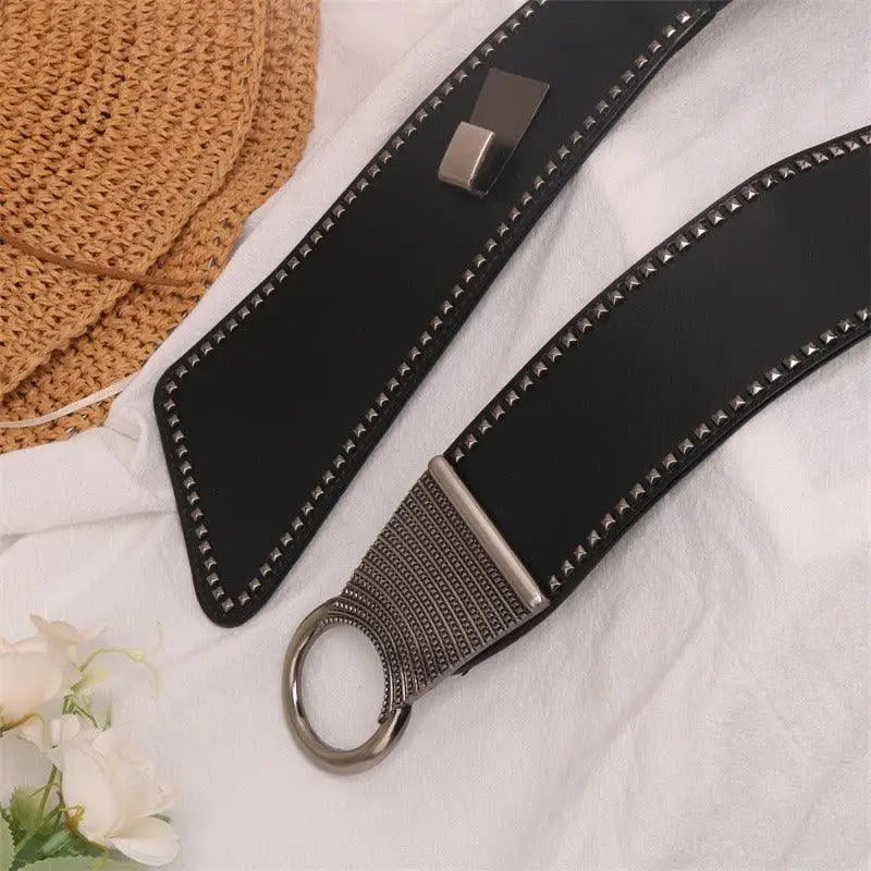 Christina Belt with studded leather design and metal ring buckle for edgy style