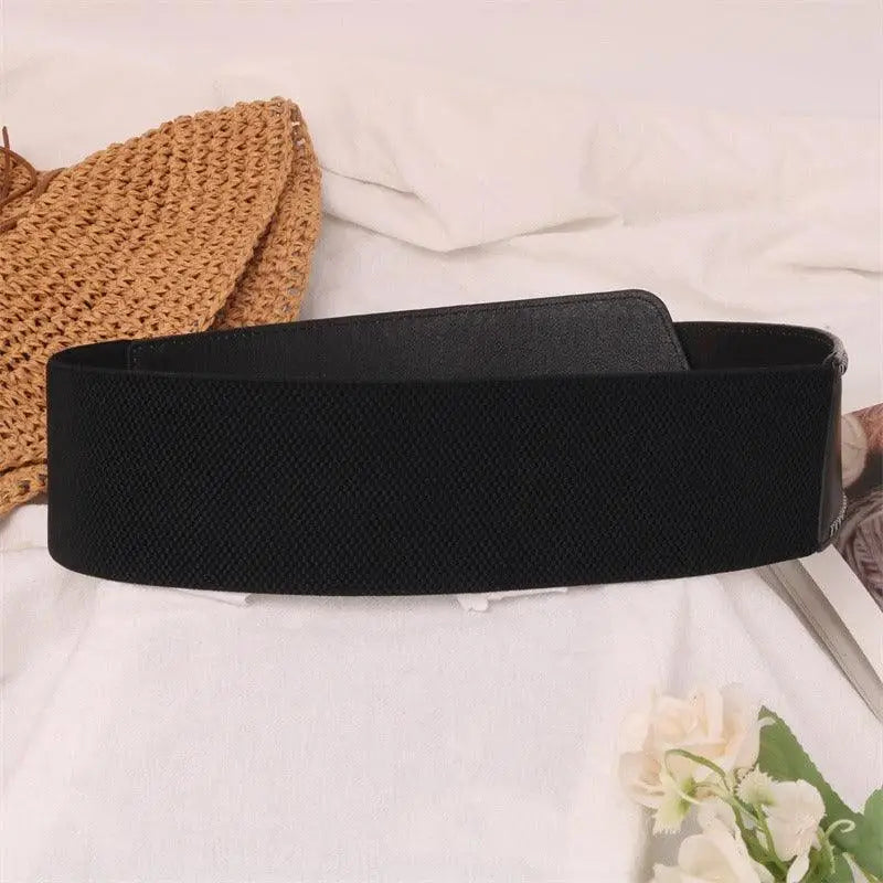 Christina Belt with elastic and studded leather design featuring a metal buckle