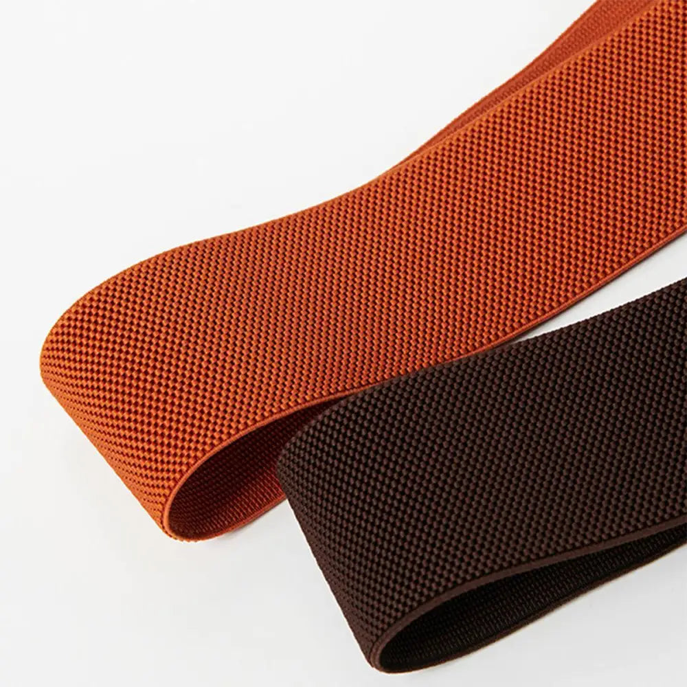 Elastic bands included with the Patterned Sleeveless Dress featuring Cassandra Belt and red waist accent