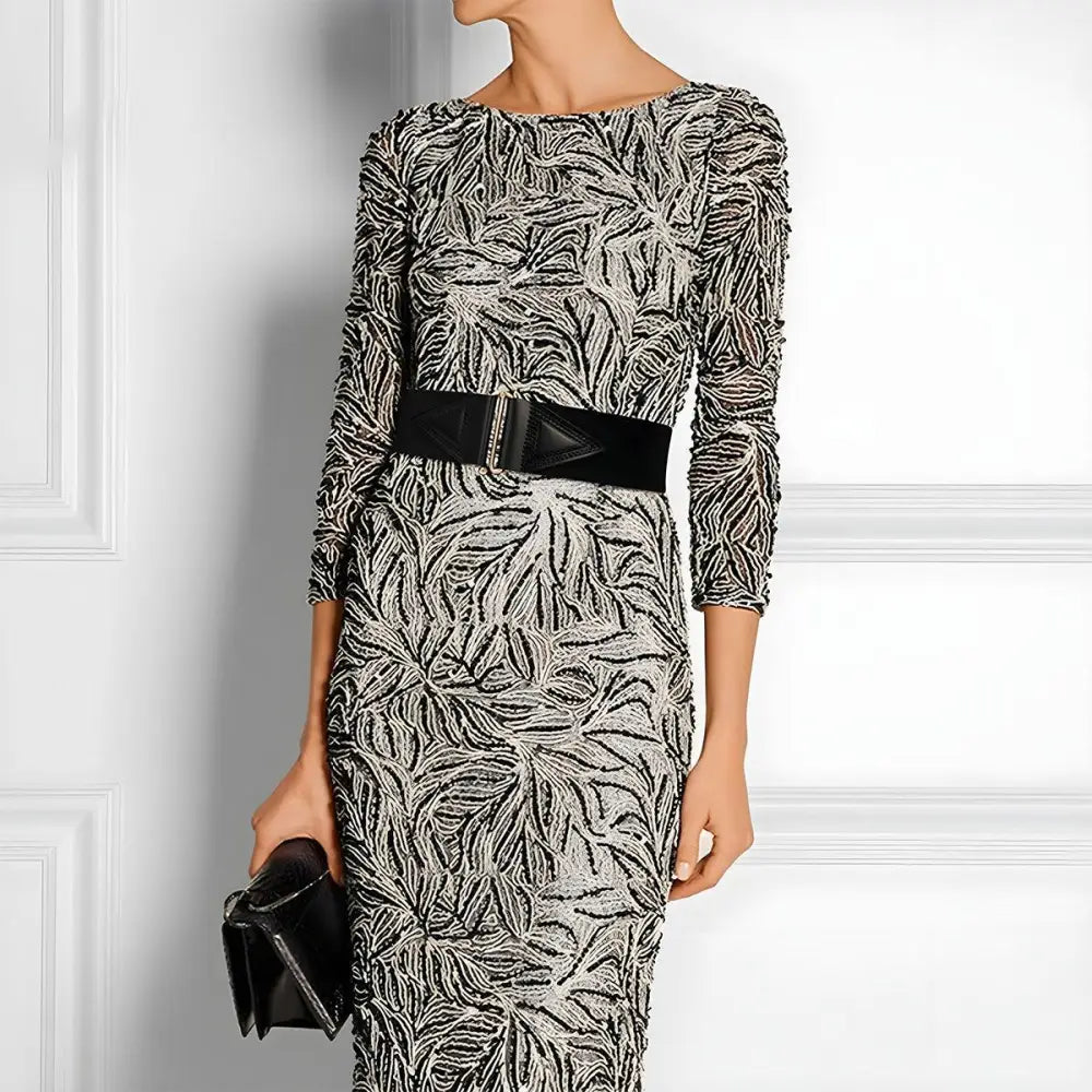 Patterned sleeveless dress with Cassandra belt and red waist accent for stylish outfits