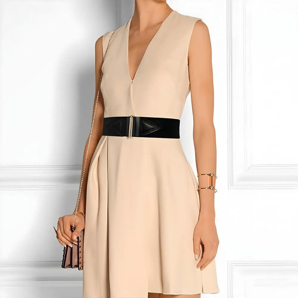 Sleeveless beige dress with Cassandra belt and red waist accent for elegant style