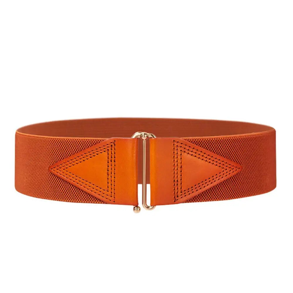 Orange elastic waist belt from the Cassandra Belt collection featured on a patterned sleeveless dress