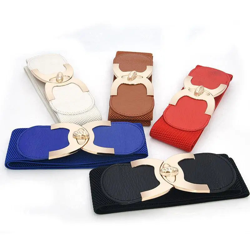 Assorted elastic waist belts with decorative buckles displayed for fashion accessories