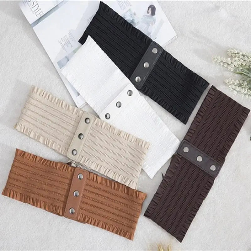 White elastic waist belt with buttoned leatherette detail for versatile fashion styling