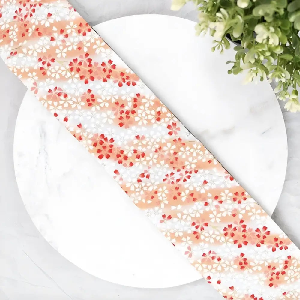Floral patterned ribbon used as an obi belt in Floral Patterned Obi Belt and Fabric Wallet Accessories