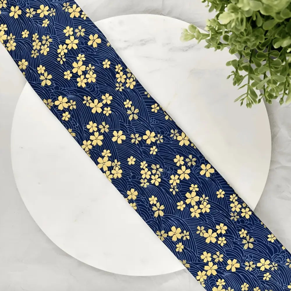 Blue fabric with yellow sakura flower-patterned obi belt and floral design for bag