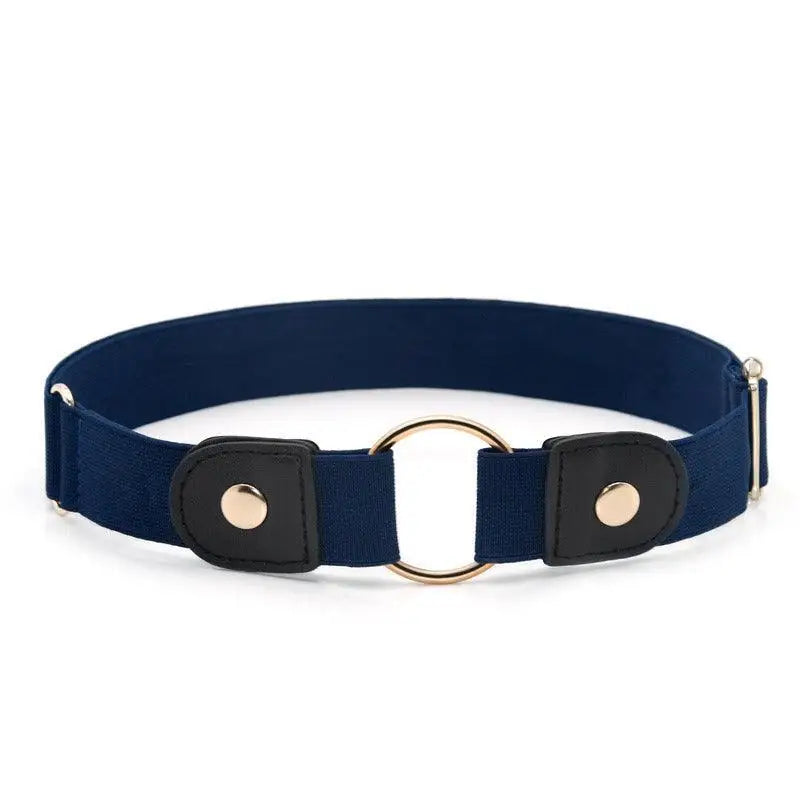 Navy blue elastic belt with gold accents paired with Floral Dress featuring beige belt and gold buckle