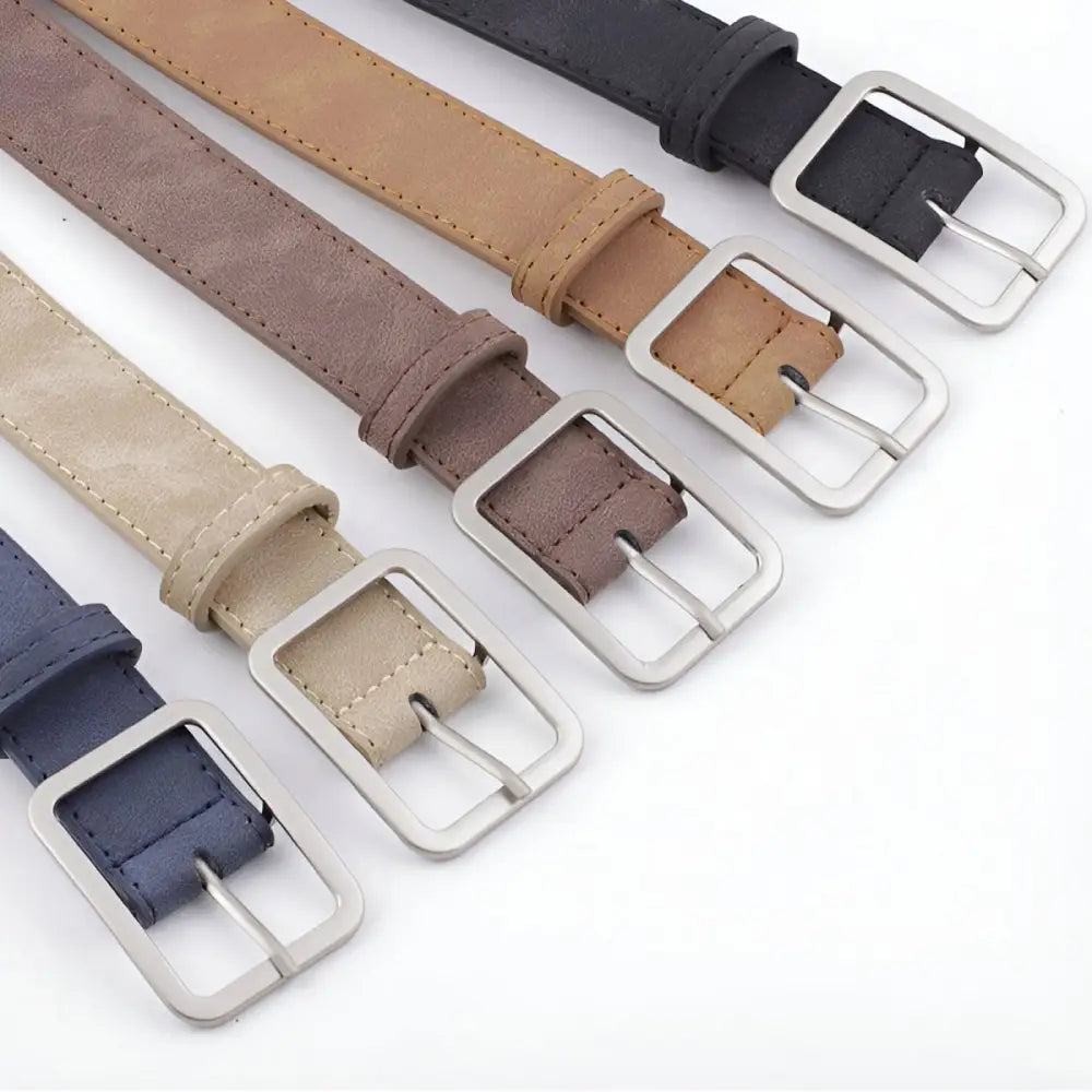 Assorted leather belts with silver metal buckles displayed for the product Assorted Leather Belts with Silver Buckles