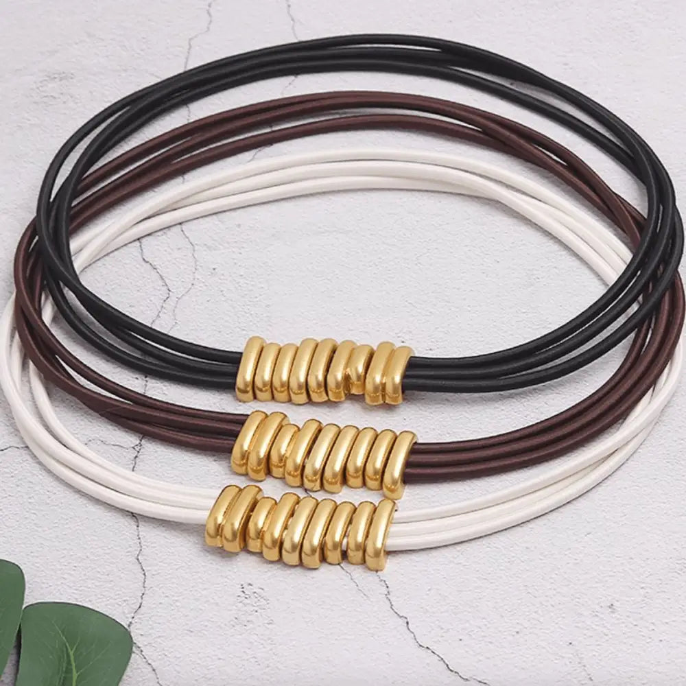 Multi-strand necklace with gold accents complementing the Elegant White Blazer with Madona Belt for trendy women’s fashion