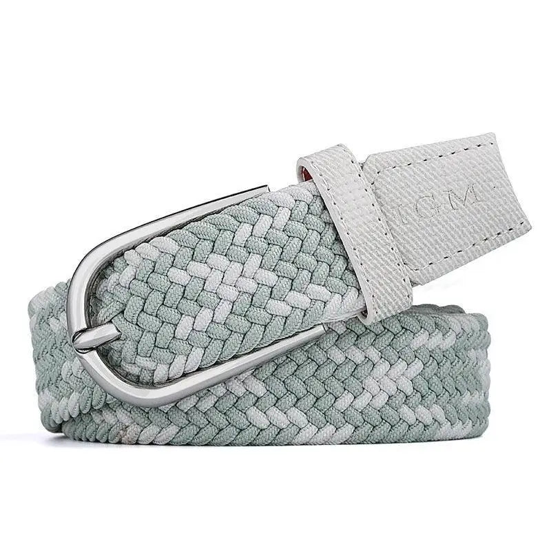 Braided elastic belt with silver buckle paired with a white blouse and dark jeans